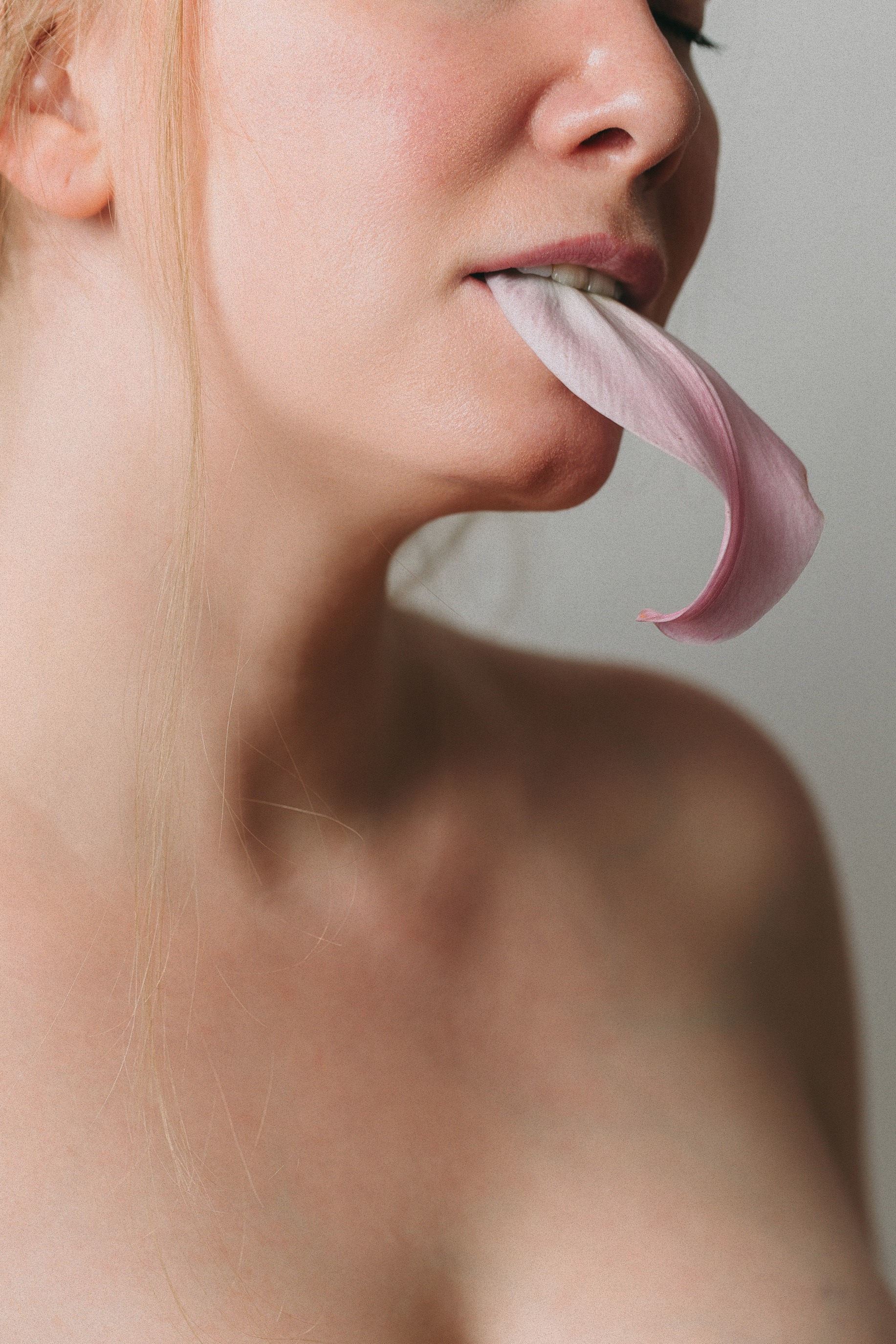 Woman Biting a Petal